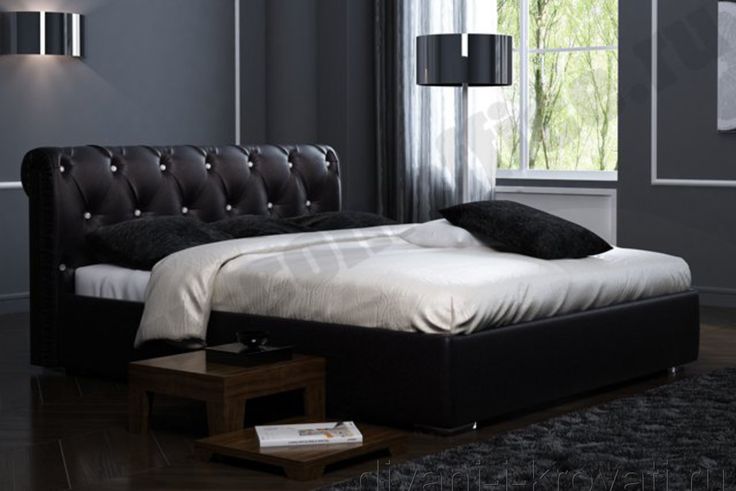 Интерьер спальни с черной красивой кроватью